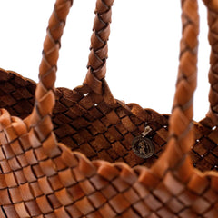 Dragon Diffusion Santa Croce Small Tan handbag with asymmetric leather straps and a woven basket-like design.