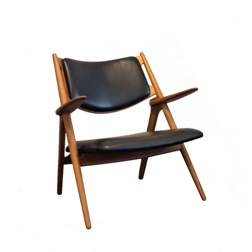 Sawbuck Lounge Chair Black Leather seat and backrest in teak natural finish