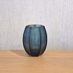 Seafog Vase 17cm in soft blue-grey-green frosted glass, its smooth vertical panels and opalescent finish giving it a quiet, luminous quality like light diffused through coastal mist.