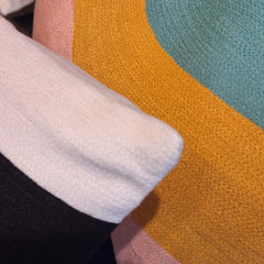 Colorful textures of the Serpe Embroidered Cushion showcasing vibrant colors and detailed stitching.