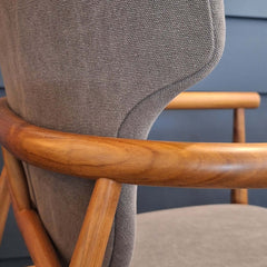 Close-up of teak backrest on Seven Armchair Cotton Canvas in dark taupe