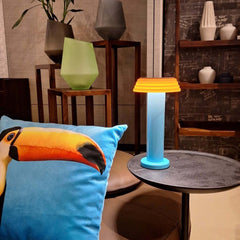 PL1 Portable Table Light Blue-Orange with a blue base and orange lampshade, designed by George Sowden.