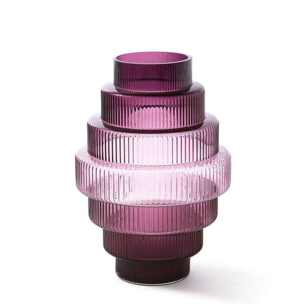 A conical large purple-colored glass vase with vertical ridges, featuring an intricate and textured design, by Pols Potten