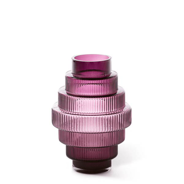 A conical purple-colored glass vase with vertical ridges, featuring an intricate and textured design, by Pols Potten