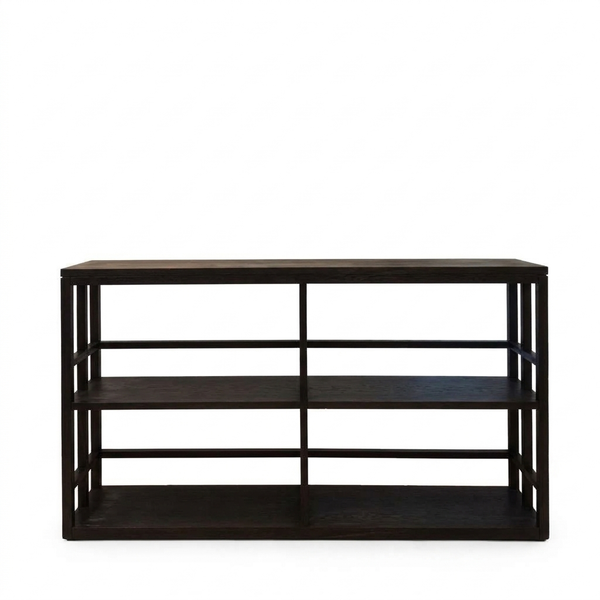 A solid timber display Tipis Low Bookshelf with four open sections, stained in charcoal color, with a visible wood grain.