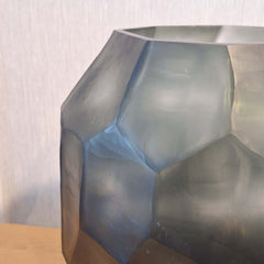 Tundra Vase 32cm in cool silver-grey frosted glass, its generous rounded form covered in large angular facets that catch light from every direction.