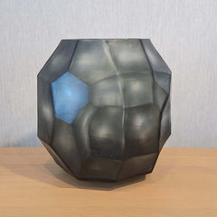 Tundra Vase 32cm in cool silver-grey frosted glass, its generous rounded form covered in large angular facets that catch light from every direction.