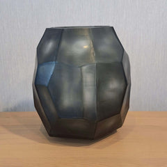 Tundra Vase 32cm in cool silver-grey frosted glass, its generous rounded form covered in large angular facets that catch light from every direction.