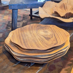 Handcrafted Wavy Plate Small Teak with a free-form edge and striking natural grain. A versatile piece for table styling, serving, or display in any interior.