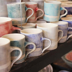 Collection of large straight mugs with watercolor-like patterns, by Wonki Ware