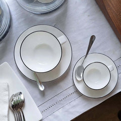 A Table Coffee Cup With Saucer and A Table Espresso Cup With Saucer with a hand-painted black line design around the edge, by ASA selection