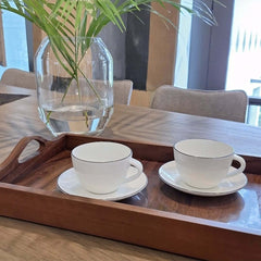 A Table Espresso Cup With Saucer with a hand-painted black line design around the edge, by ASA selection