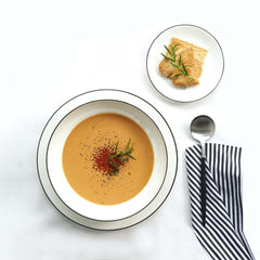 A white fine bone china A Table dinnerware with a hand-painted black line design around the edge, by ASA selection