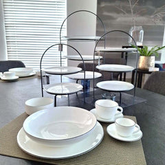 A Table Espresso Cup With Saucer with a hand-painted black line design around the edge, by ASA selection