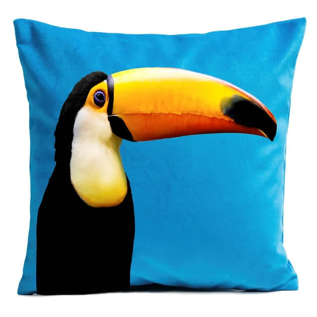Toucan Cushion 40x40cm with a vibrant blue background featuring a printed image of a toucan.