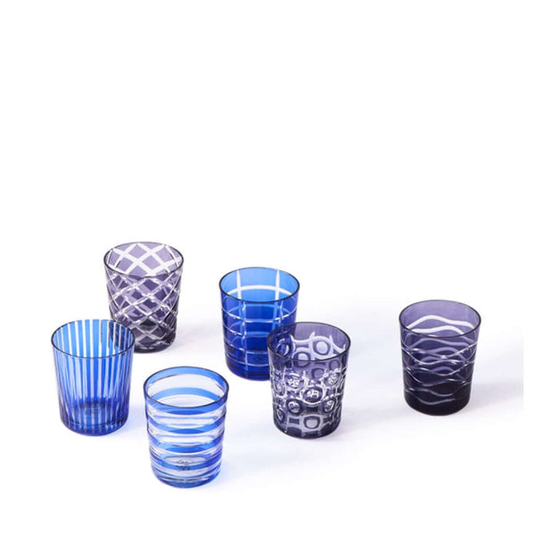 A set of six cobalt blue colored glass tumblers, each with a unique geometric pattern, by Pols Potten