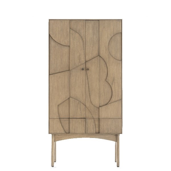A simple bookcase with abstract patterns on the front doors, made of wood and finished in a new beech colour, with round brass door handles.