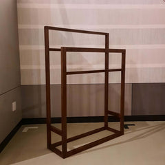 A two-tier walnut Kain Hanger with a straight-line silhouette, suitable for hanging towels or displaying scarves.