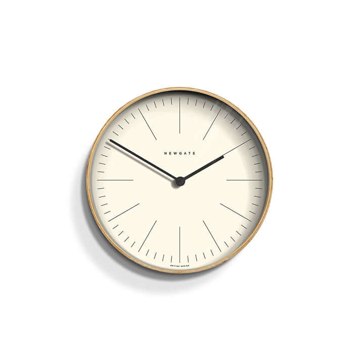 Newgate Mr Clarke Wall Clock Pale Wood with a linear marker dial, metal hands, and a glass lens.