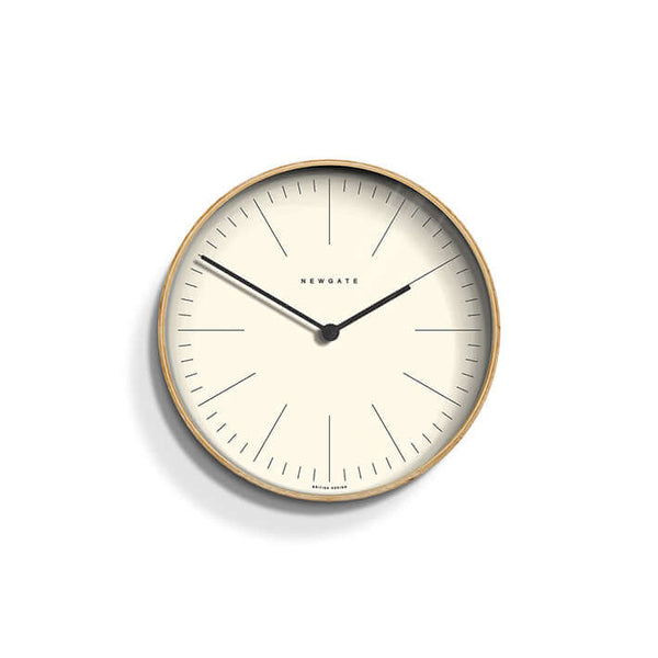 Newgate Mr Clarke Wall Clock Pale Wood with a linear marker dial, metal hands, and a glass lens.