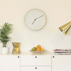 Newgate Mr Clarke Wall Clock Pale Wood on a living room wall