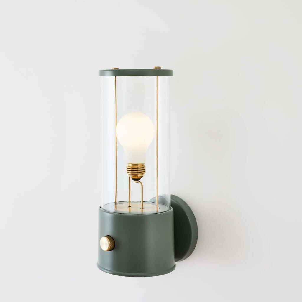 The Muse Wall Light Pleasure Garden Green, featuring solid brass detailing and an integrated dimmer switch.