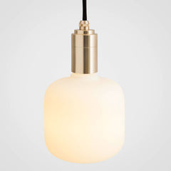 An oblong-shaped LED bulb with a matte glass finish, emitting a soft white light, designed to screw into an Edison-style base, by Tala