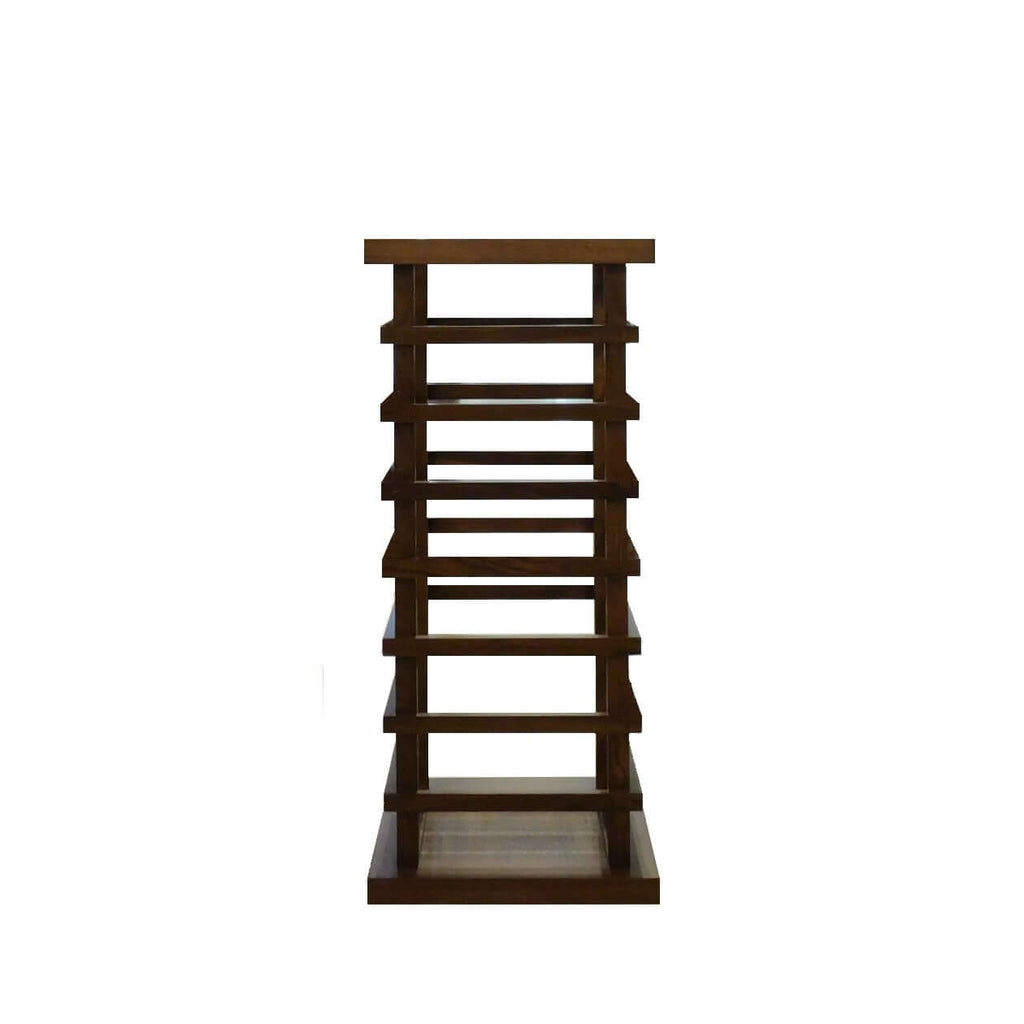 A solid walnut umbrella stand with a decorative ladder-like structure