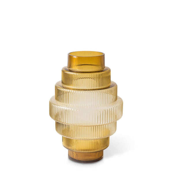 A conical amber-colored glass vase with vertical ridges, featuring an intricate and textured design, by Pols Potten