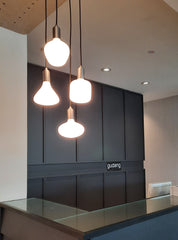 A family of porcelain LED bulb with a matte glass finish, emitting a soft white light, designed to screw into an Edison-style base, by Tala