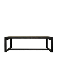 A Tas coffee table with a glass top and charcoal-colored solid ash wood legs