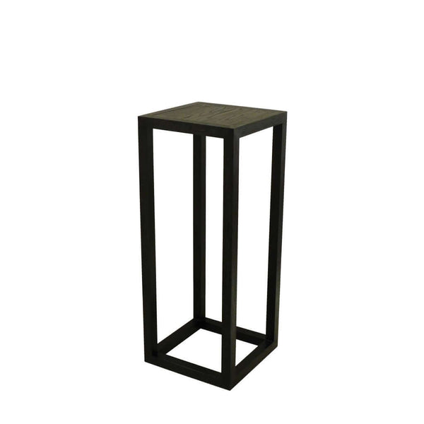 Tipis Pedestal Medium Ash made of solid ash wood with an open pore finish in charcoal color, designed to display vases, plants, or sculptures.