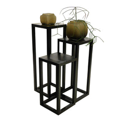 Tipis Pedestal Medium Ash made of solid ash wood with an open pore finish in charcoal color, designed to display vases, plants, or sculptures.