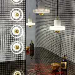 Marble round shaped wall and pendant lights by Tom Dixon