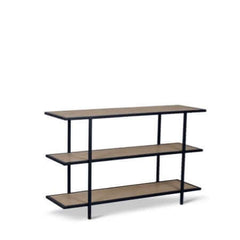 A black powder coated steel Yombe Console with three shelves, featuring a slatted wood pattern on the shelves. 